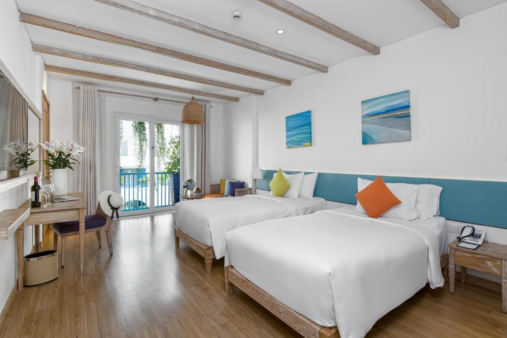 Giường trong phòng chung tại Risemount Premier Resort Da Nang