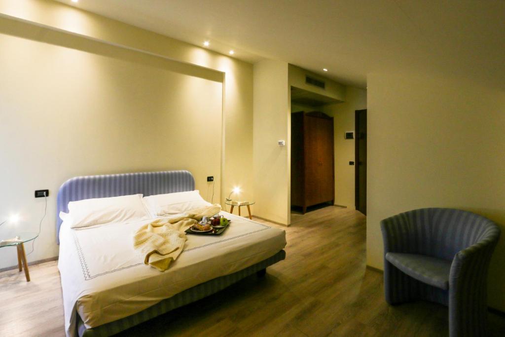 Uma cama ou camas num quarto em Hotel Miage