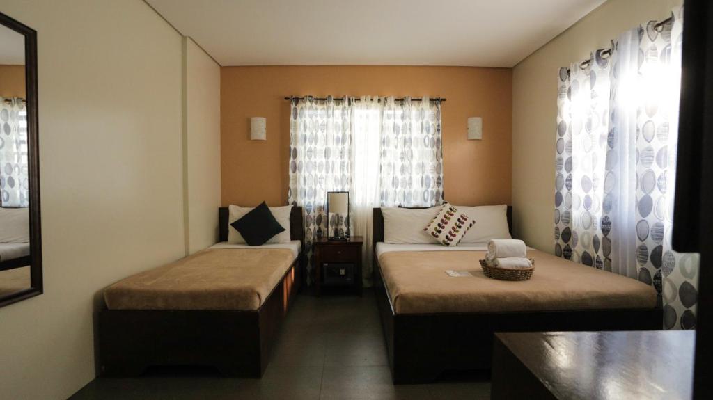 Postel nebo postele na pokoji v ubytování Casa Coron Hotel