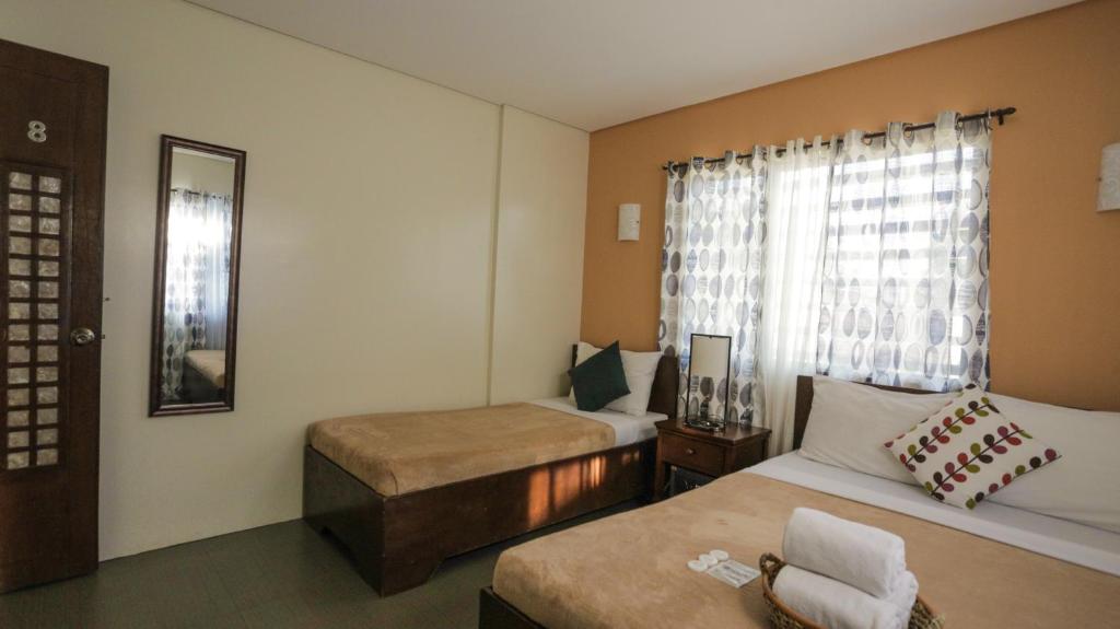 Postel nebo postele na pokoji v ubytování Casa Coron Hotel