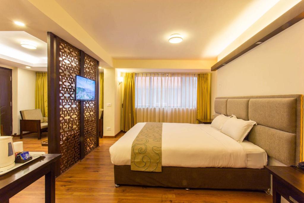 Postel nebo postele na pokoji v ubytování Potala Guest House