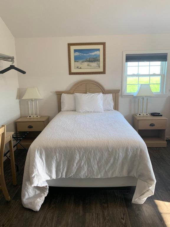 Postel nebo postele na pokoji v ubytování Cape Motel