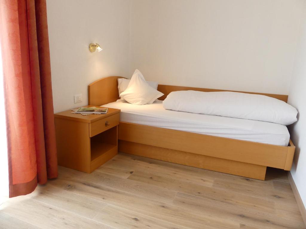 Postel nebo postele na pokoji v ubytování Garni Hotel Dorothea