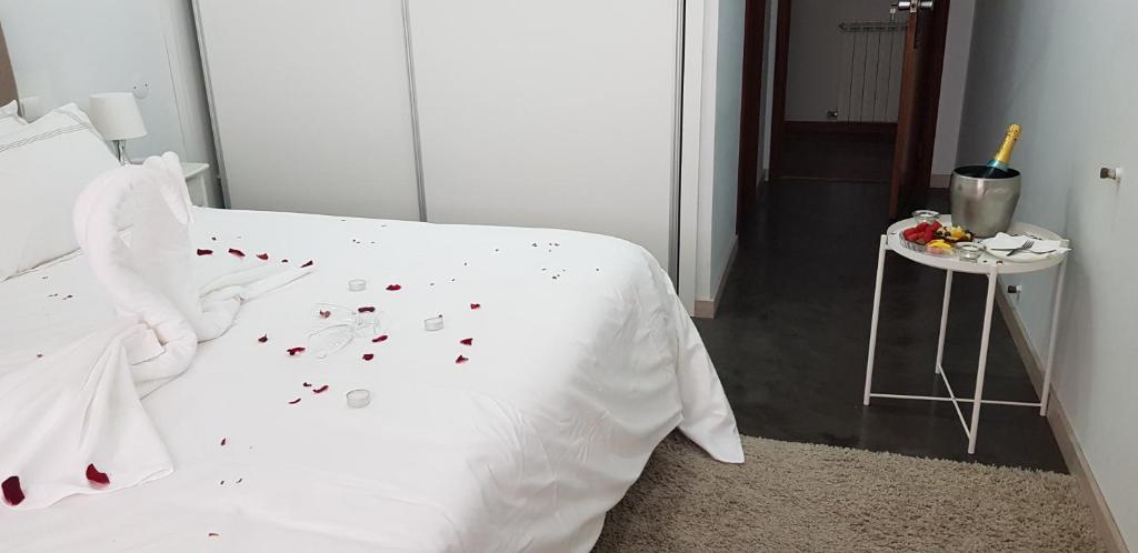 Postel nebo postele na pokoji v ubytování Residencial Dom Manuel