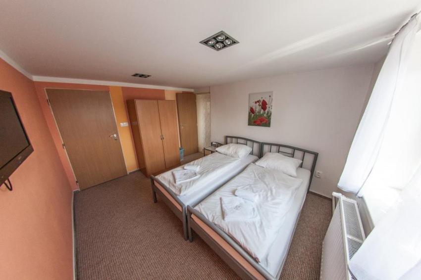 Postel nebo postele na pokoji v ubytování Penzion SLANINA