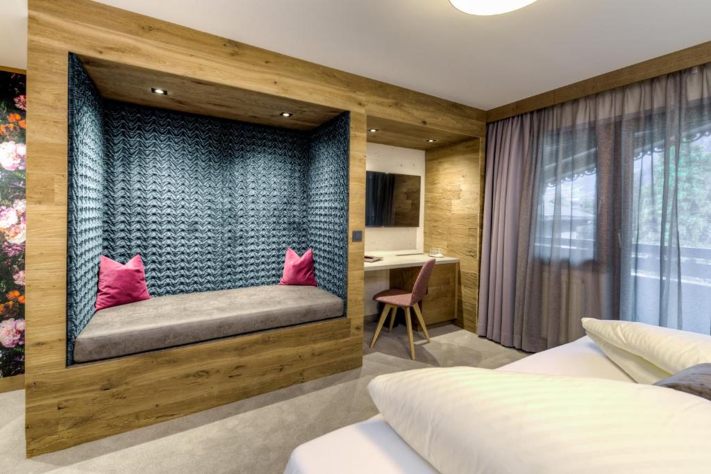Postel nebo postele na pokoji v ubytování Hotel Rose