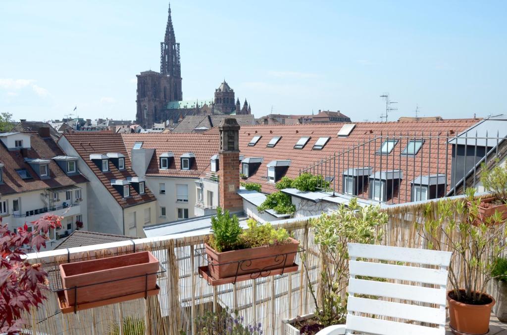 a view of a city from a balcony at 145m² city center 4 bedrooms view of the Cathedral in Strasbourg
