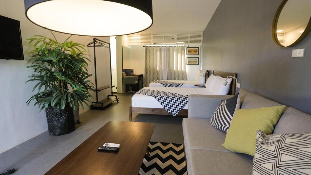 Postel nebo postele na pokoji v ubytování Treetop Suites