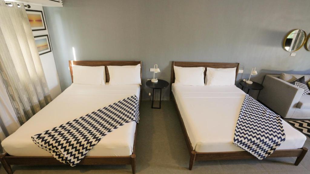 Postel nebo postele na pokoji v ubytování Treetop Suites
