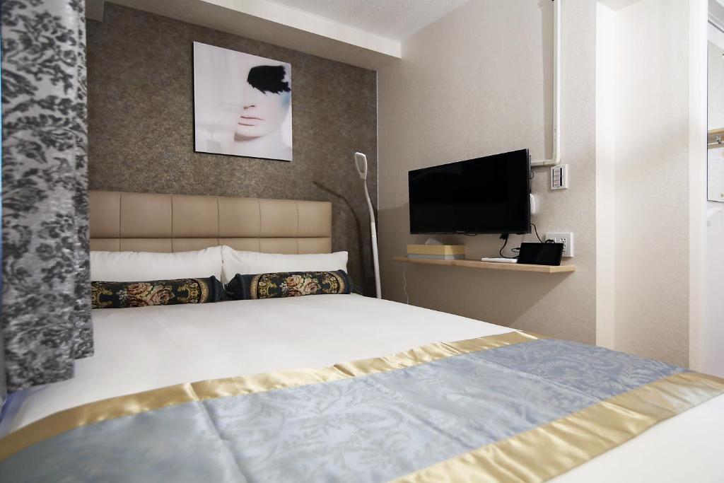 Postel nebo postele na pokoji v ubytování SHINJUKU GLOBAL HOTEL