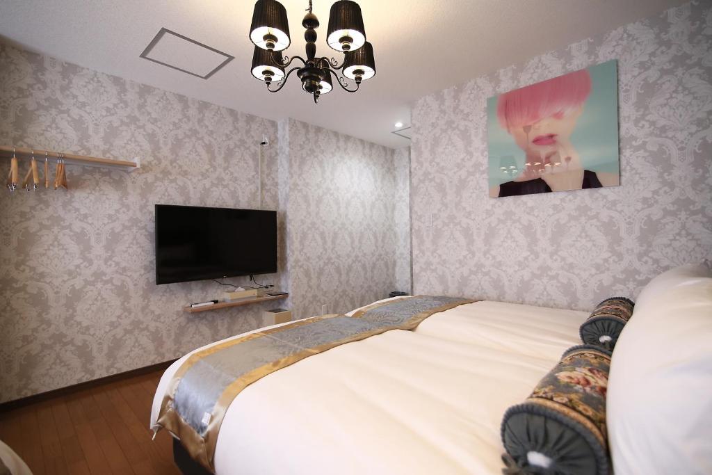 TV a/nebo společenská místnost v ubytování SHINJUKU GLOBAL HOTEL