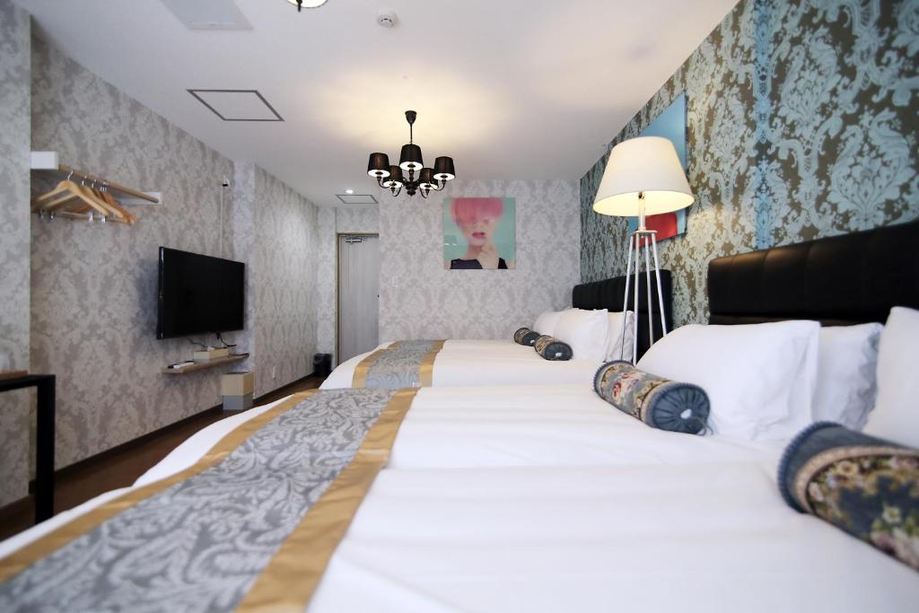 Postel nebo postele na pokoji v ubytování SHINJUKU GLOBAL HOTEL