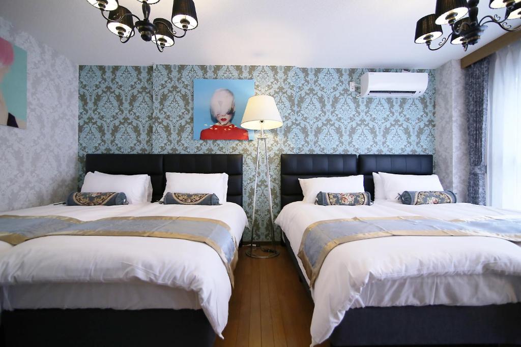 Postel nebo postele na pokoji v ubytování SHINJUKU GLOBAL HOTEL