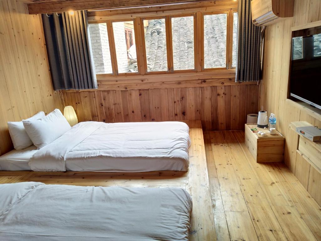 Postel nebo postele na pokoji v ubytování Tong Sang Art Hotel