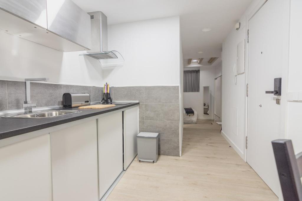Kuchyň nebo kuchyňský kout v ubytování Slow León Apartamentos Turísticos