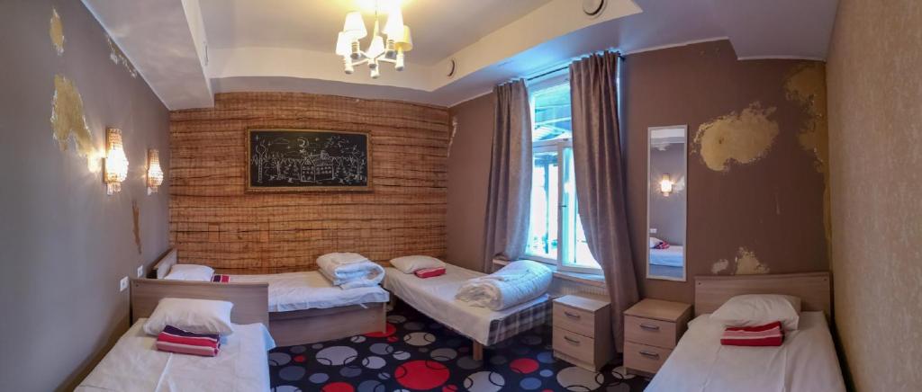 Postel nebo postele na pokoji v ubytování Villa Kadriorg Hostel
