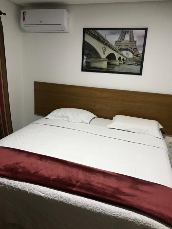 Ένα ή περισσότερα κρεβάτια σε δωμάτιο στο Hotel Joma
