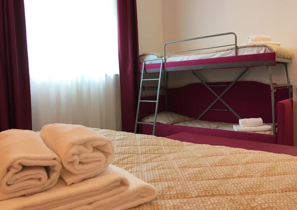 Postel nebo postele na pokoji v ubytování Alma Living Hotel- Al Girarrosto