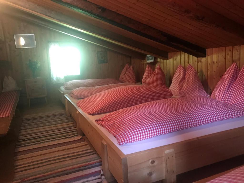 Postel nebo postele na pokoji v ubytování Senninger Alm