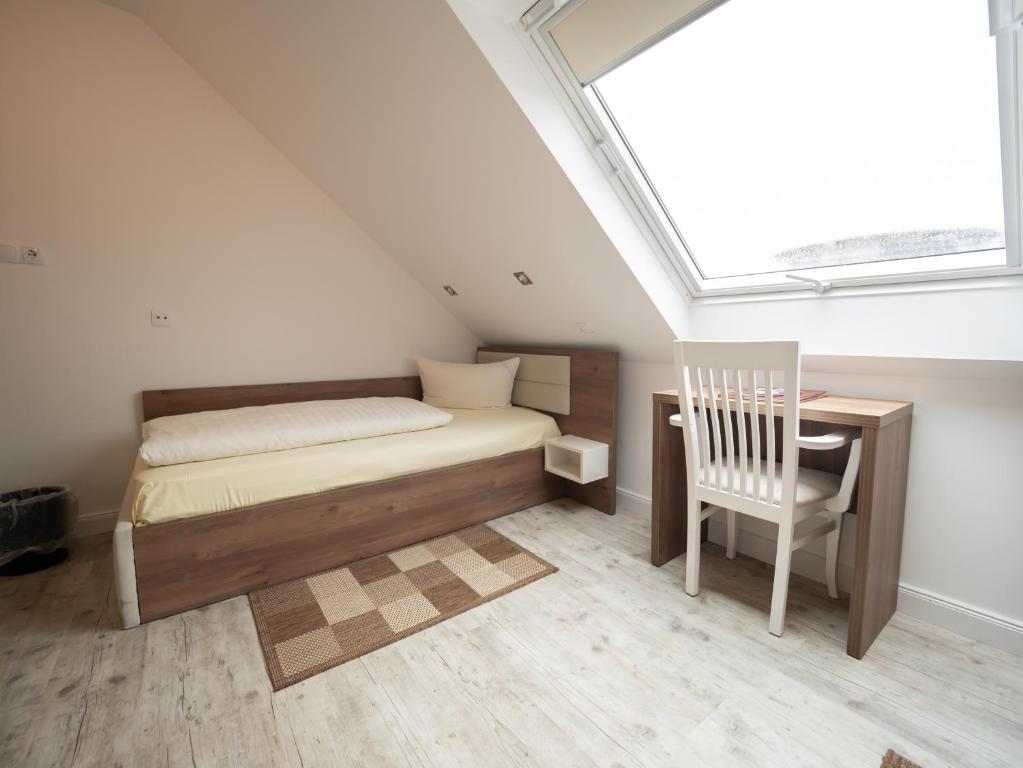 Postel nebo postele na pokoji v ubytování Hotel Boritzka