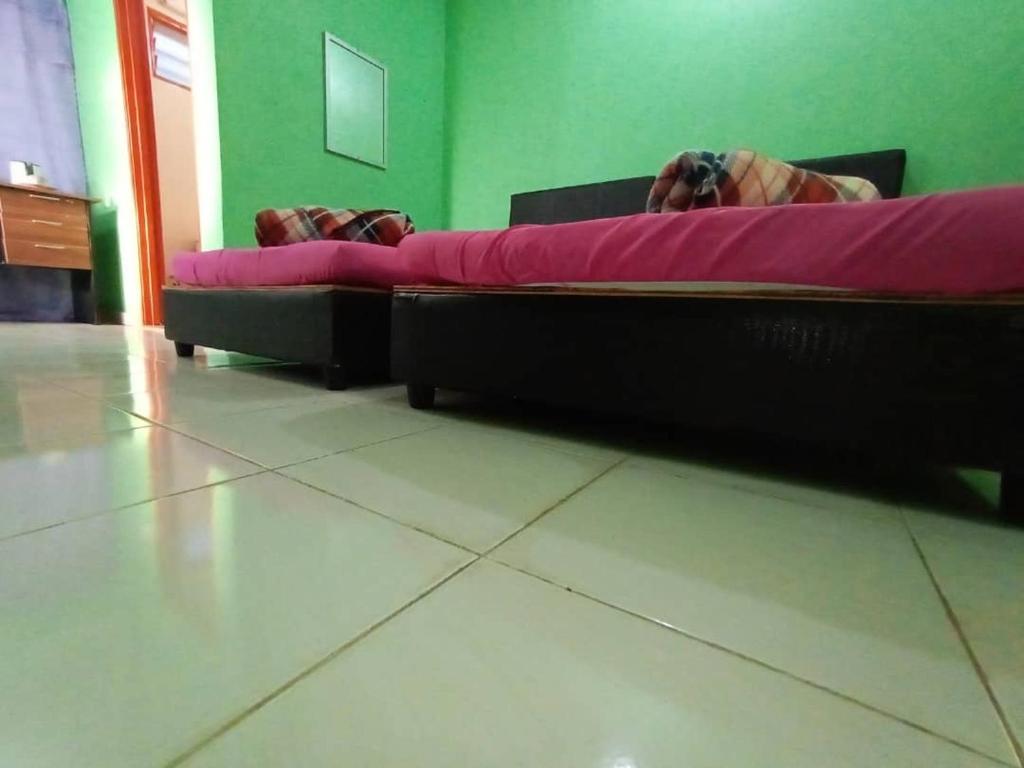 Postel nebo postele na pokoji v ubytování DAOH'S Rooms & Scooters