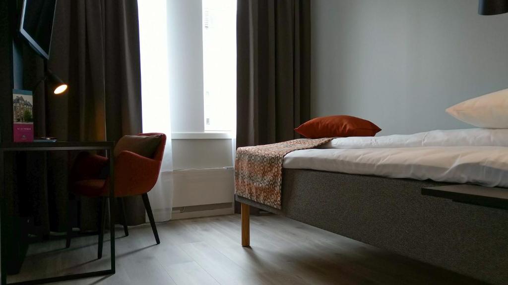 Postel nebo postele na pokoji v ubytování Quality Hotel Augustin