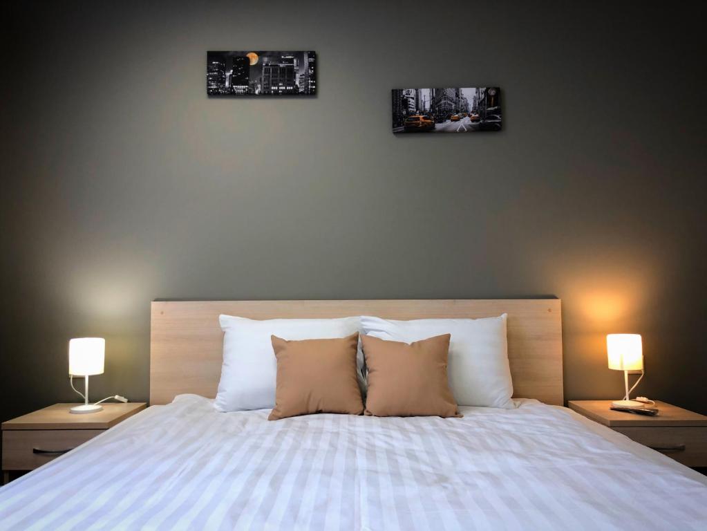 
Кровать или кровати в номере New City Inn
