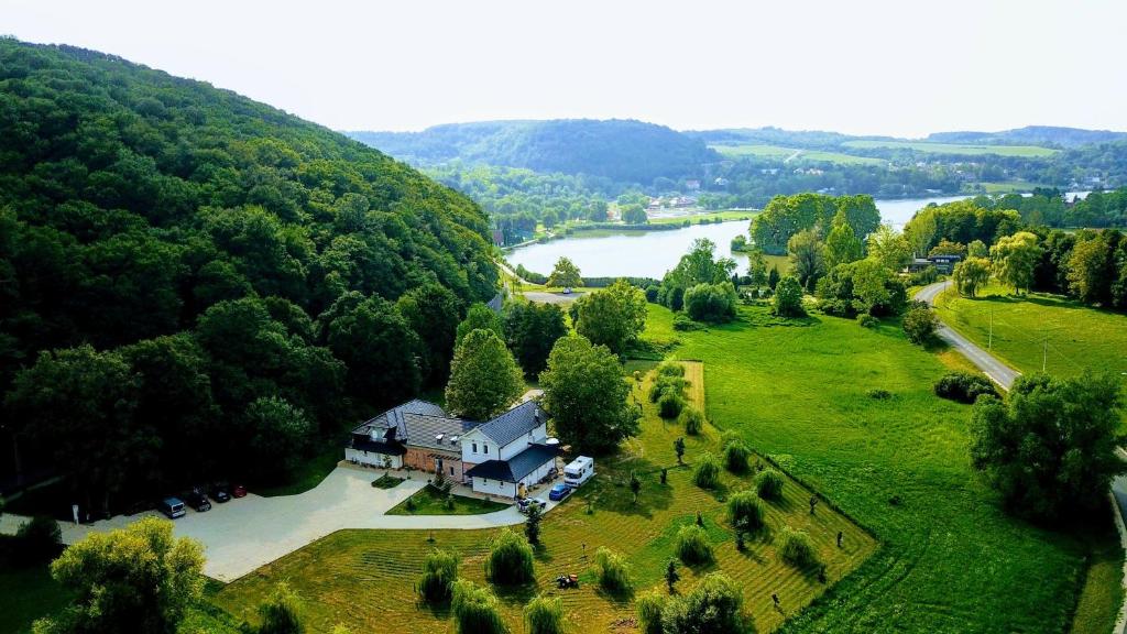 an aerial view of a house and a river at Varga Villa in Orfű