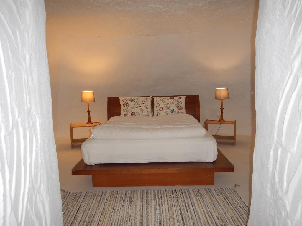 Postel nebo postele na pokoji v ubytování Vivelorural casa La Cuevita, Santa Brígida