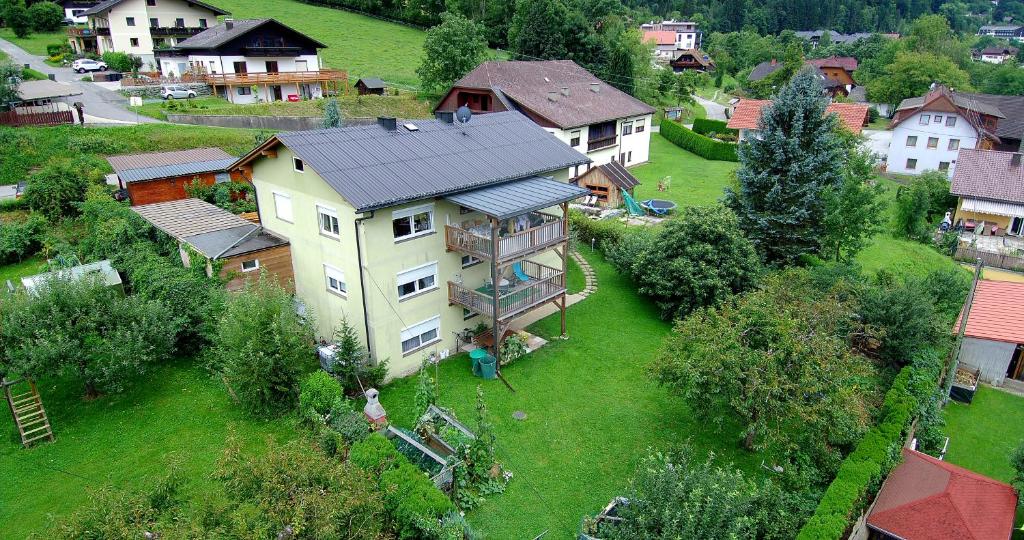 an aerial view of a large house in a village at Ferienwohnungen Struggl in Ossiach
