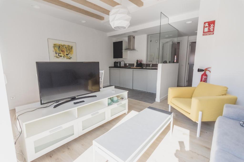 TV a/nebo společenská místnost v ubytování Slow León Apartamentos Turísticos