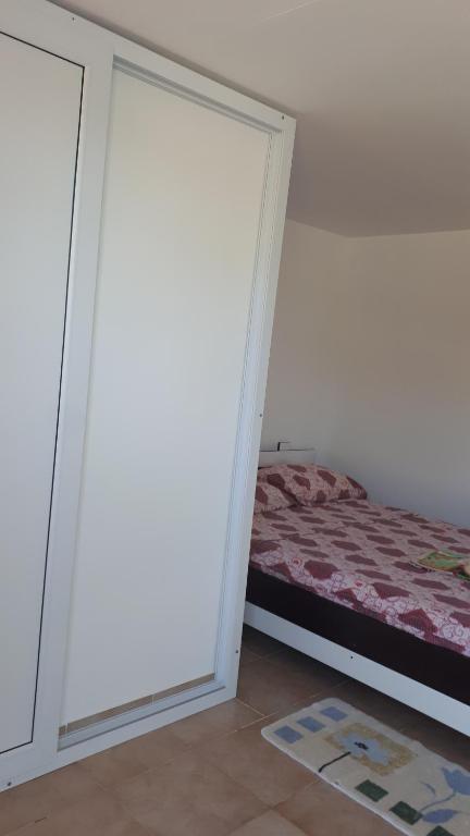 Postel nebo postele na pokoji v ubytování La Olteanu