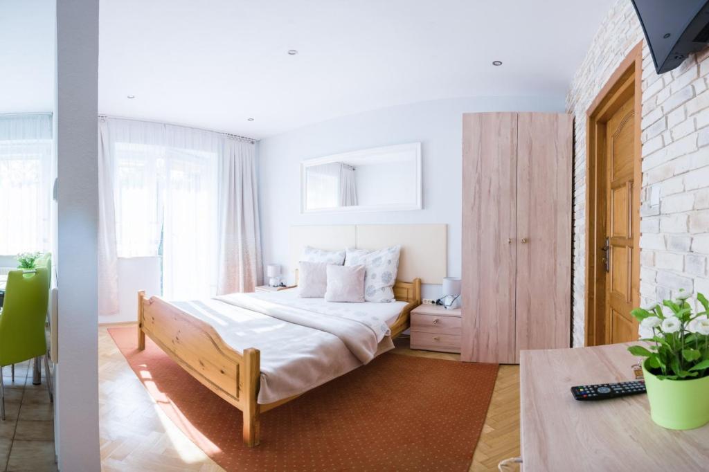 Łóżko lub łóżka w pokoju w obiekcie A&B Apartments II