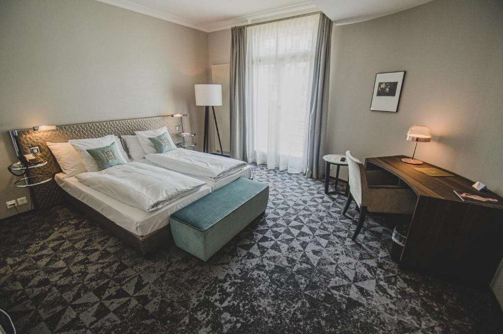 Voodi või voodid majutusasutuse GLANDON Rooms Elite toas