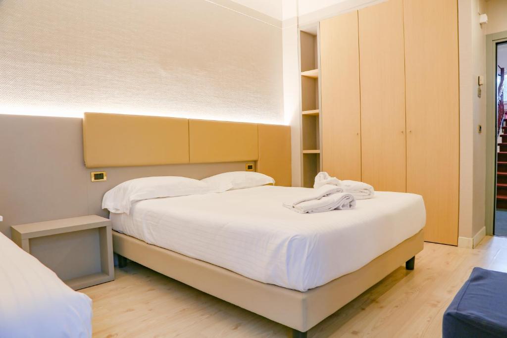 Postel nebo postele na pokoji v ubytování Hotel Augustus