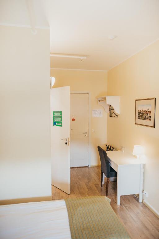 Postel nebo postele na pokoji v ubytování Economy Hotel