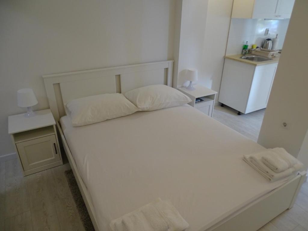 Posteľ alebo postele v izbe v ubytovaní Job studio apartments