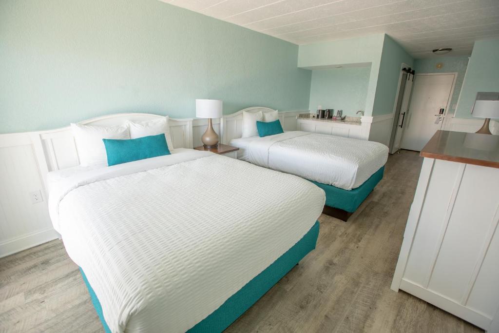 Cama o camas de una habitación en John Yancey Oceanfront Inn