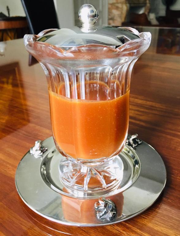 a glass blender on a silver plate on a table at LES CHAMBRES D&#39;HOTES DU PALAIS in Douai