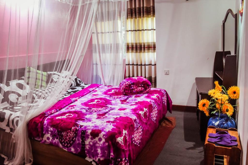 Postel nebo postele na pokoji v ubytování Green Haven Villa & Guest House