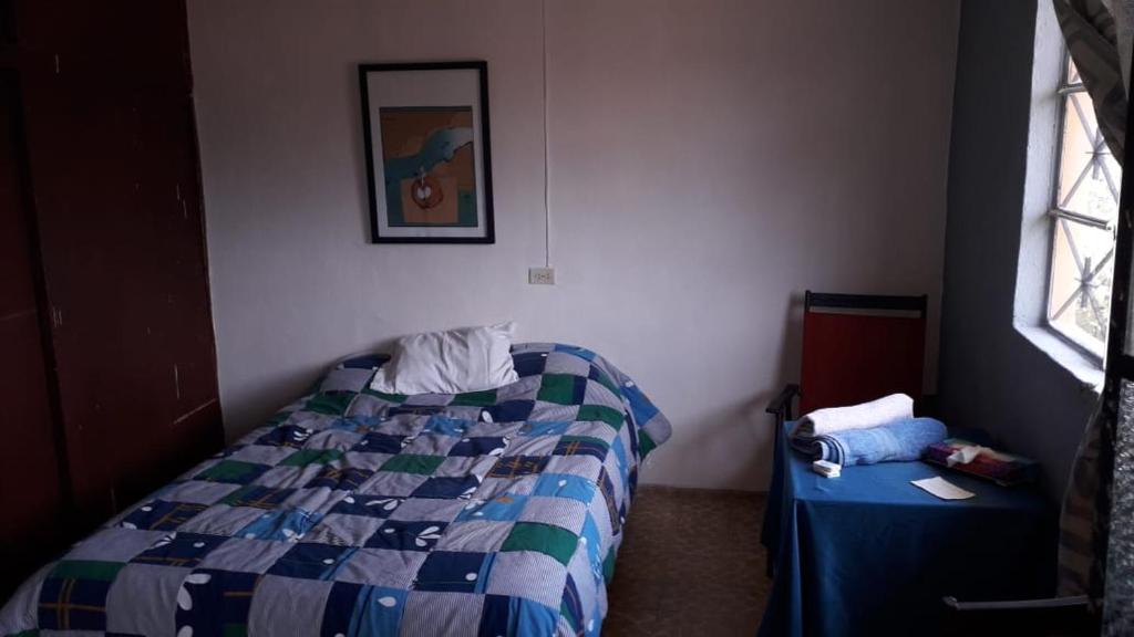 Postel nebo postele na pokoji v ubytování El laberinto hospedaje en casa