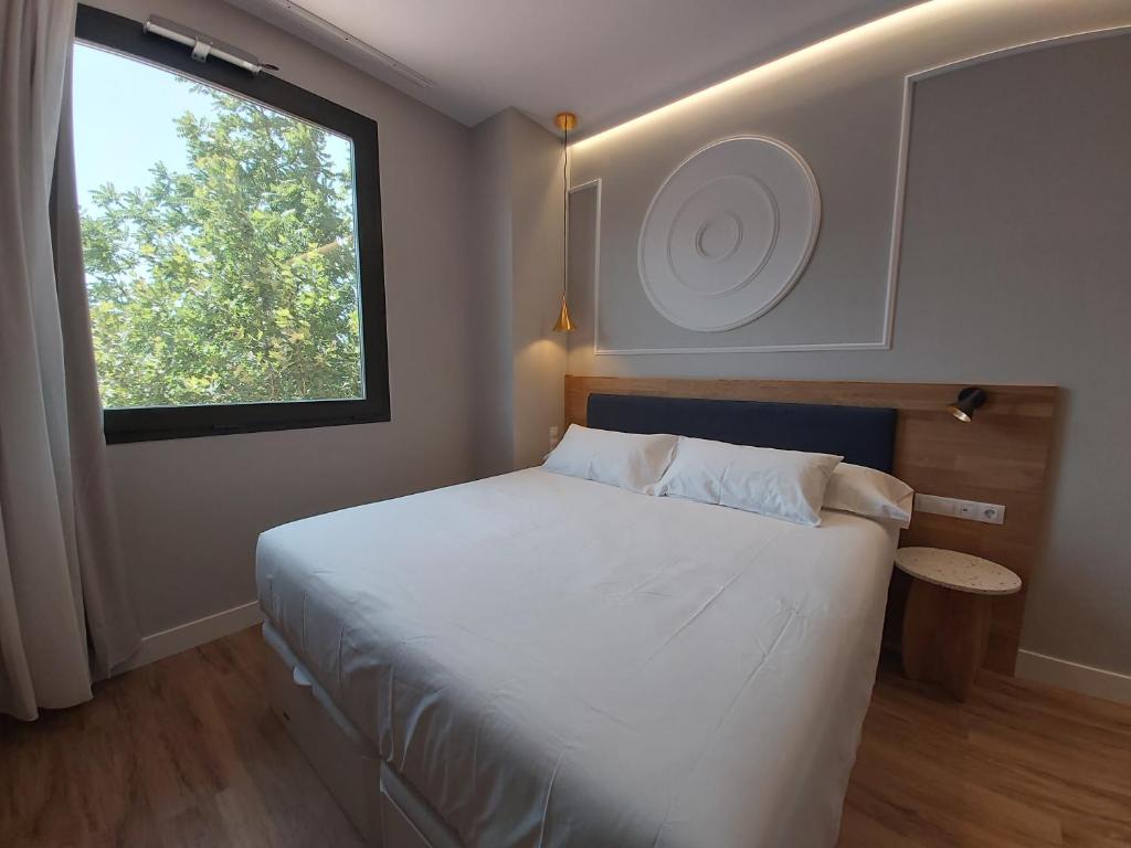 Postel nebo postele na pokoji v ubytování Habital Suites