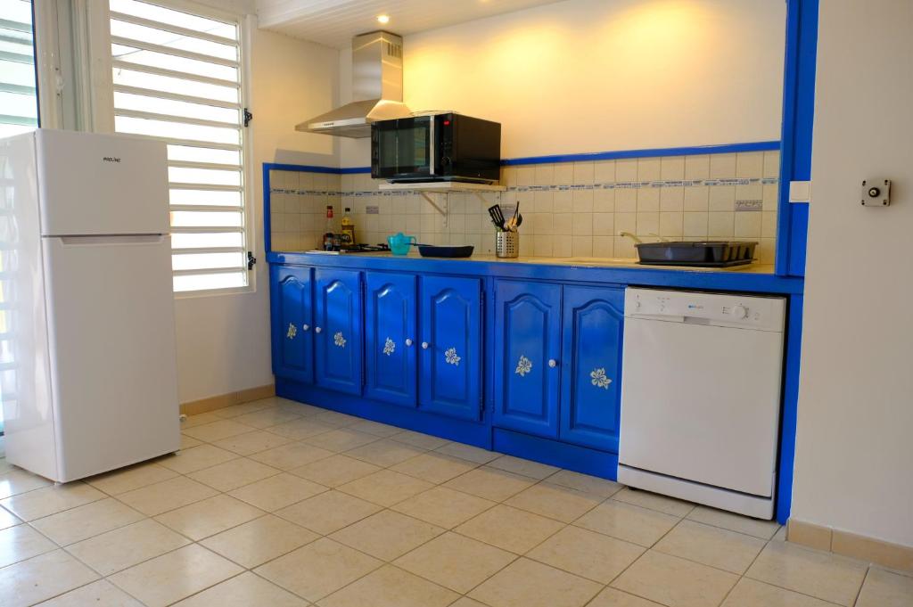 Kuchyň nebo kuchyňský kout v ubytování Habitation Diamant - Apparts & Spas