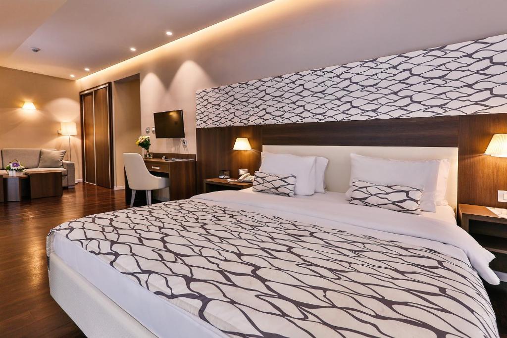 Hotel Palma tesisinde bir odada yatak veya yataklar