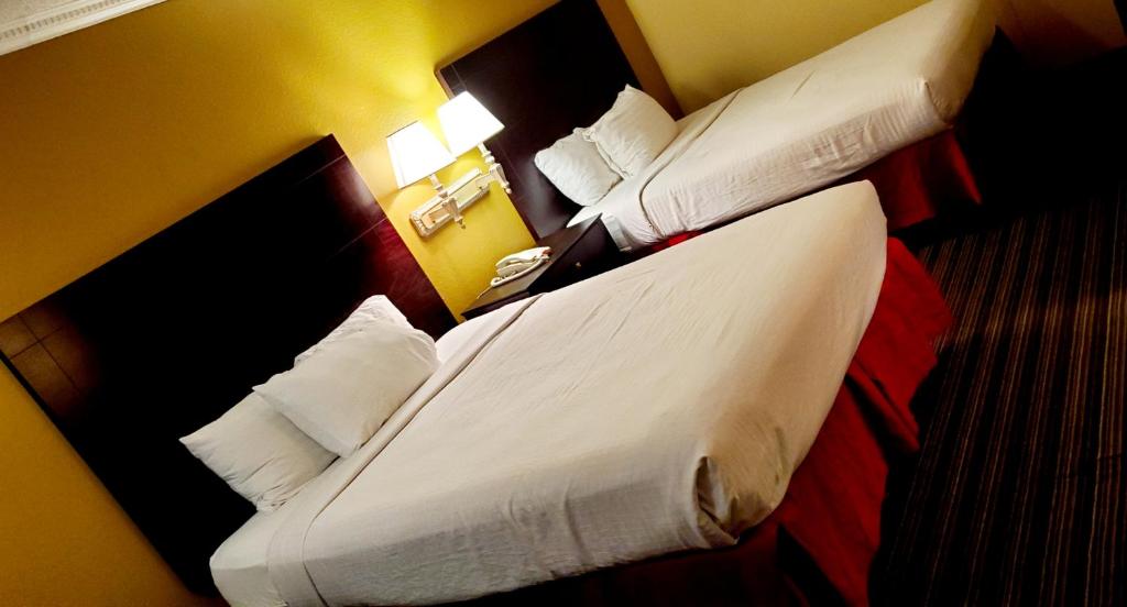 Un pat sau paturi într-o cameră la Sweet Dream Inn
