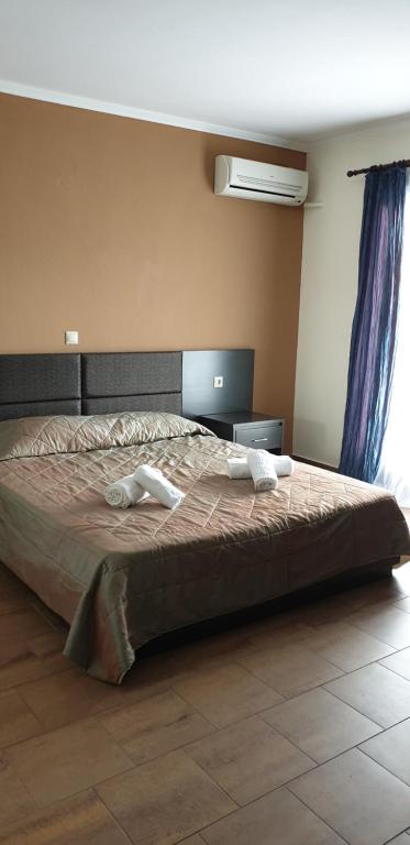 Łóżko lub łóżka w pokoju w obiekcie Melima