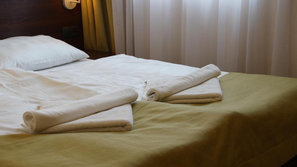 Posteľ alebo postele v izbe v ubytovaní Aparthotel Lumen