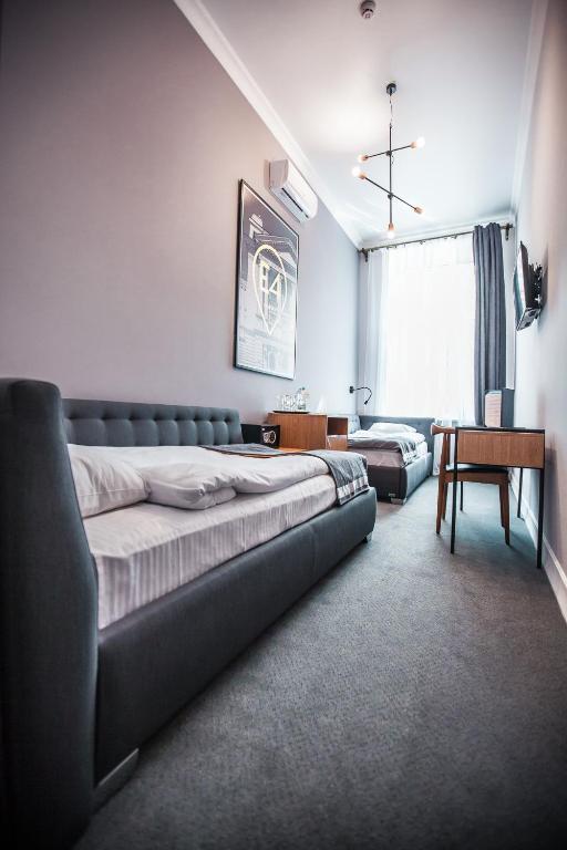 Postel nebo postele na pokoji v ubytování E4 Hotel