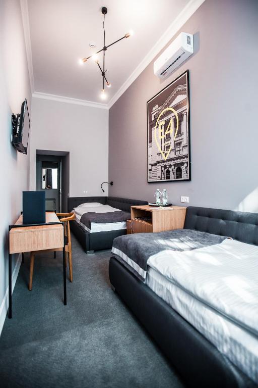 Postel nebo postele na pokoji v ubytování E4 Hotel
