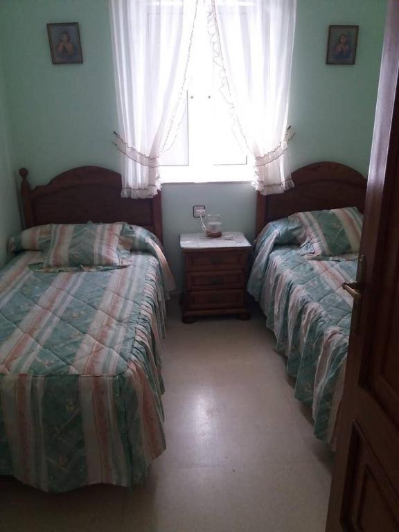 Postel nebo postele na pokoji v ubytování Casa Cristina